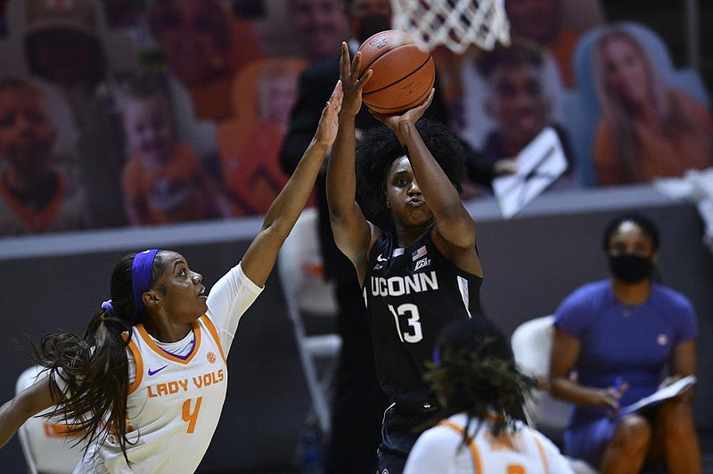 Arkansas native Christyn Williams (13) puts up a shot for Connecticut during the No. 3 Huskies’ 67-61 victory over No. 25 Tennessee on Thursday. Williams led UConn with 20 points. 
(AP/Saul Young)