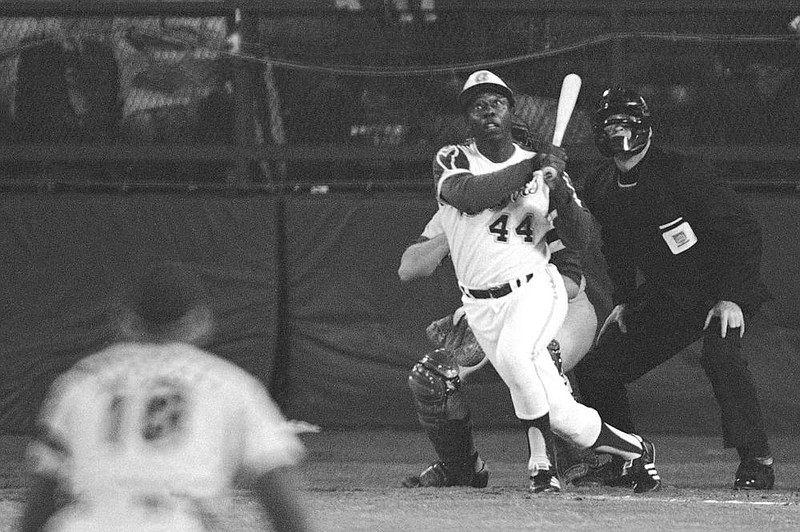 Hank Aaron watches his 715th career home run, which broke Babe Ruth’s major-league record, on April 8, 1974. Aaron died Friday morning. He was 86. More photos at arkansasonline.com/123hankaaron.
(AP file photo)