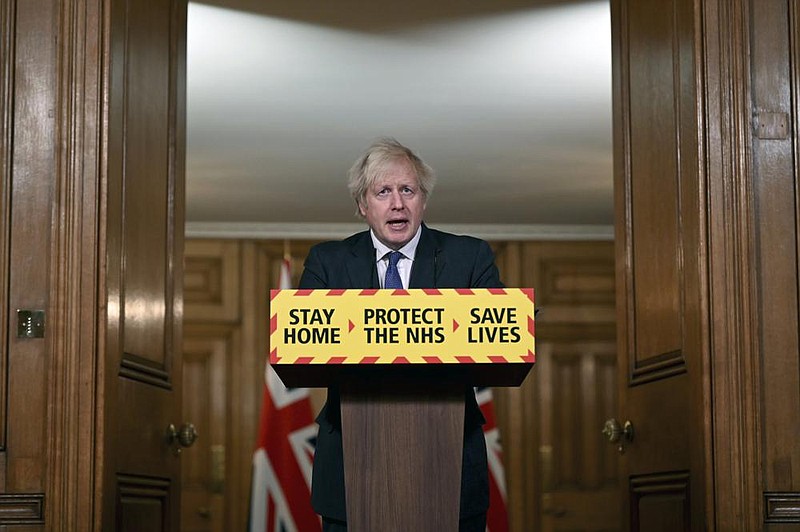 Britain’s Prime Minister Boris Johnson announced Friday in London that the new variant of covid-19, which was first discovered in the south of England, may be linked with an increase in the country’s mortality rate. More photos at arkansasonline.com/123ukcovid/.
(AP/Leon Neal)