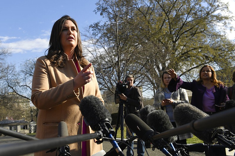 Sarah Huckabee Sanders, then the White House press secretary, speaks to reporters outside the West Wing of the White House in Washington in this March 25, 2019, file photo.
