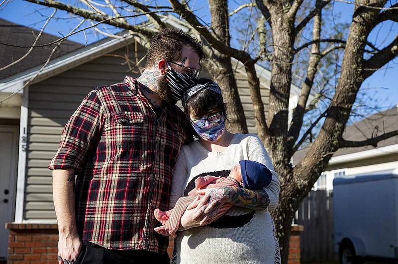 Aaron Walker self-quarantined at home with his wife, Katy Dobson, in the early days of the pandemic. He’s back to work at a tattoo shop now, after a couple of months at home.
(For The Washington Post/Meggan Haller)