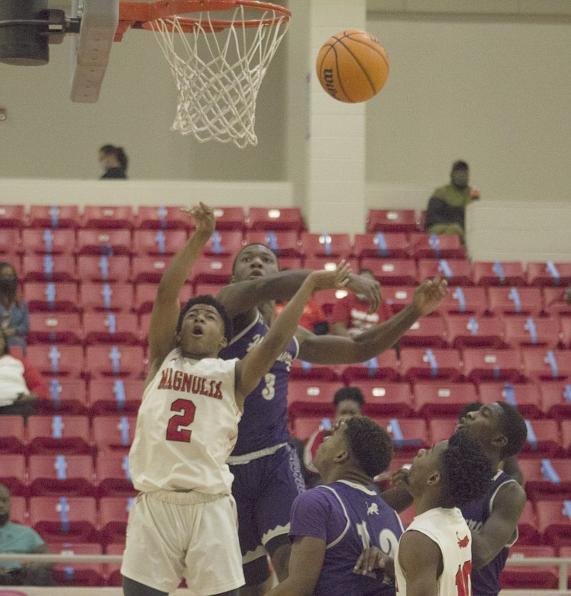 Banner-News/Chris Gilliam
Magnolia sophomore Nevi Tell (2) has his shot blocked by a Hamburg defender he goes up for two points during a recent game. The Panthers will be on the road twice this week, starting with Warren on Tuesday and Watson Chapel on Friday.