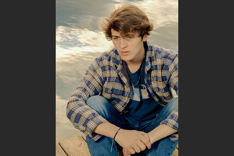 Gabriel Horne, who performs as Kidd G, poses at his grandfather’s lakehouse in Hamilton, Ga., on Dec. 28. The 17-year-old from a small Georgia town built an audience as a rapper on TikTok and SoundCloud before pivoting to country music and inching his way into a notoriously cloistered industry. (The New York Times/Peyton Fulford)