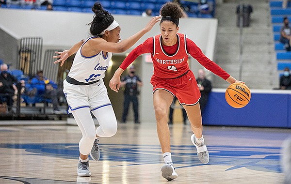 Fort Smith Northside guard Jersey Wolfenbarger (4) dribbles the ball against Conway guard Chloe Clardy during a game Friday, Jan. 15, 2021, in Conway.
