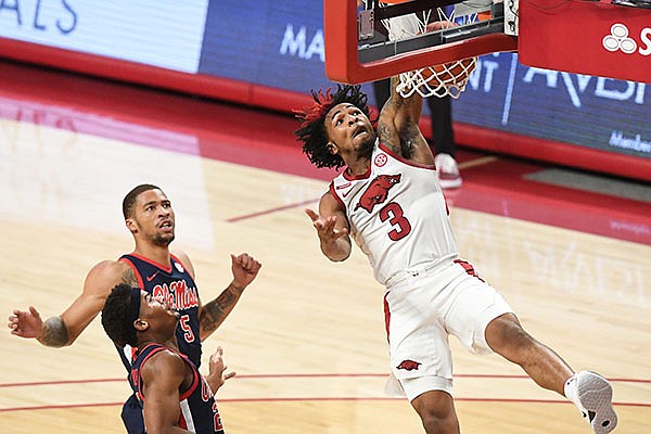 Arkansas guard Desi Sills (3) dunks the ball during a game against Ole Miss on Wednesday, Jan. 27, 2021, in Fayetteville. 