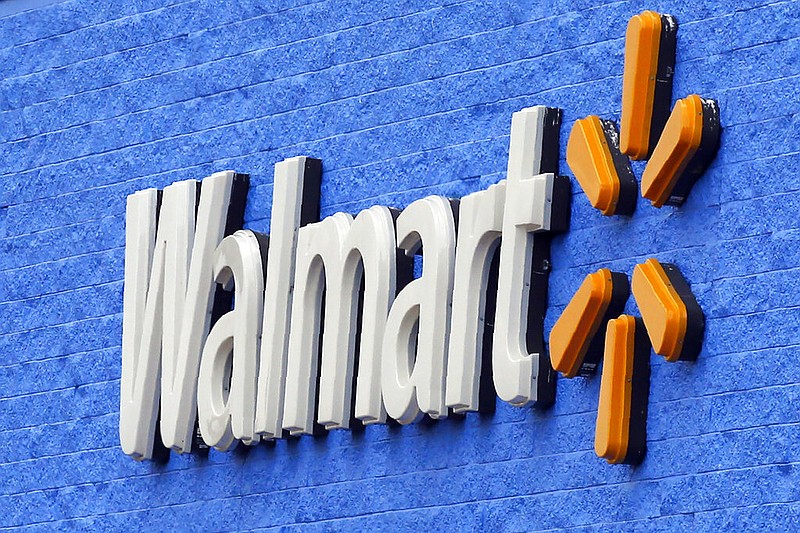 FILE - In this Tuesday, Aug. 4, 2020, file photo, signage is pictured at a Walmart store in Oklahoma City.