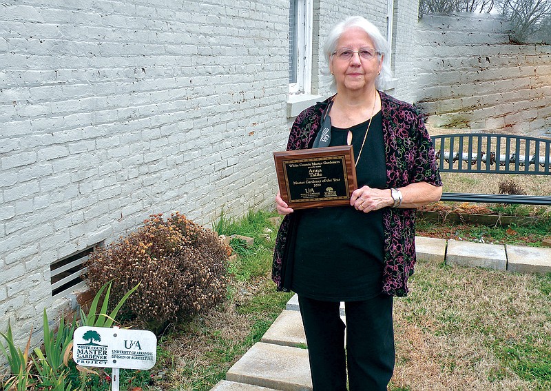 Anna Tallie is the 2020 White County Master Gardener of the Year. Among the projects at the El Paso Community Library has been the installation of a bench, shown behind Tallie.