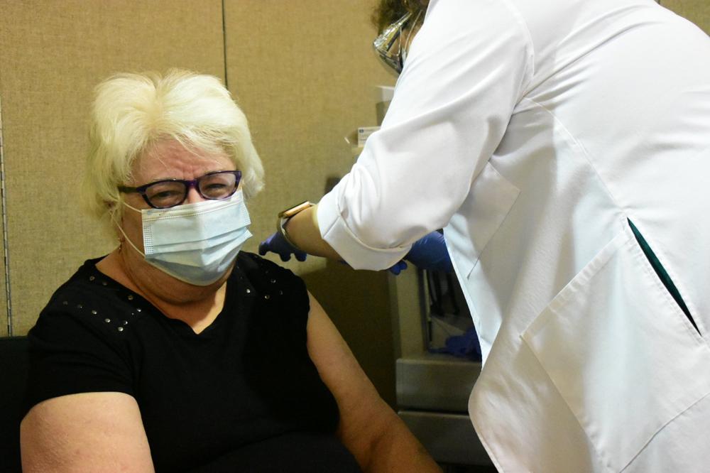 First shots given for 70 and older; few report ill effects at city clinic