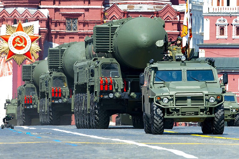 FILE - In this file photo taken on Wednesday, June 24, 2020, Russian RS-24 Yars ballistic missiles roll in Red Square during the Victory Day military parade marking the 75th anniversary of the Nazi defeat in Moscow, Russia. Russia and the United States exchanged documents Tuesday Jan. 26, 2021, to extend the New START nuclear treaty, their last remaining arms control pact, the Kremlin said. The Kremlin readout of a phone call between U.S. President Joe Biden and Russian President Vladimir Putin said they voiced satisfaction with the move. (AP Photo/Alexander Zemlianichenko, File)