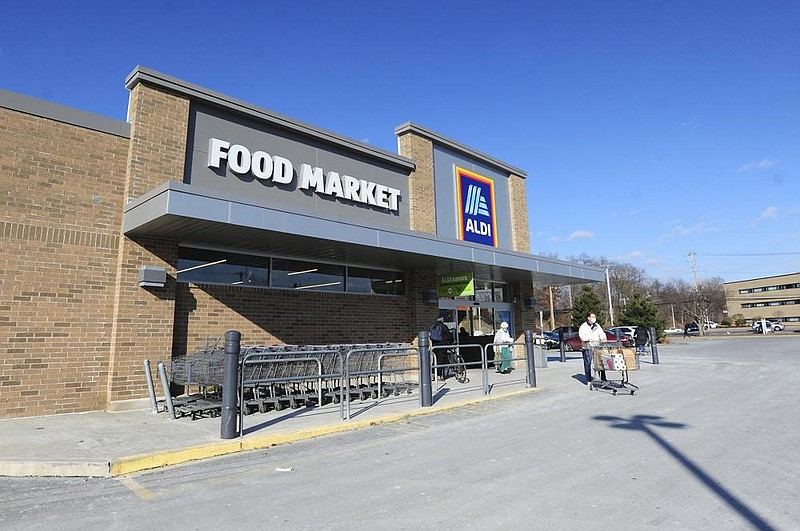 Shoppers patronize an Aldi Food Market in Kingston, Pa., earlier this week. Aldi is among the chains that are paying its workers to get vaccinated.
(AP/The Citizens’ Voice/Mark Moran)