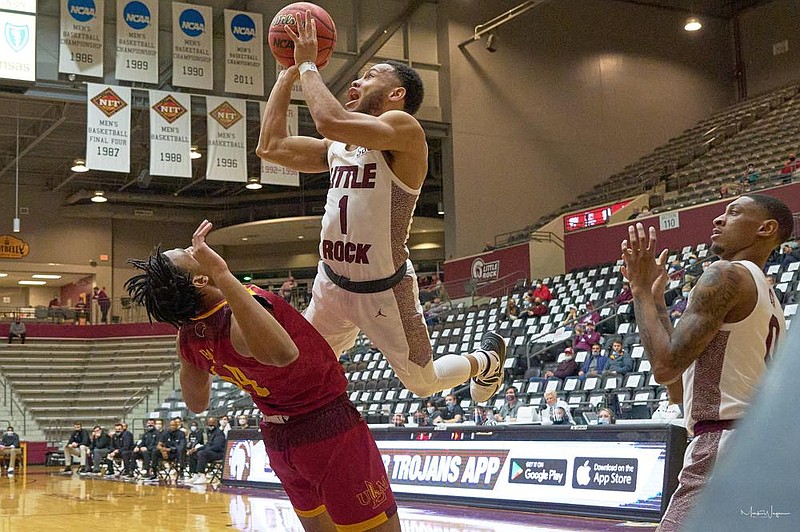 UALR’s Markquis Nowell (right, with the ball) puts up a shot Friday over a Louisiana-Monroe defender during the Trojans’ 66-62 victory overthe Warhawks at the Jack Stephens Center in Little Rock. Nowell finished with 17 points.
(Photo courtesy UALR Athletics)