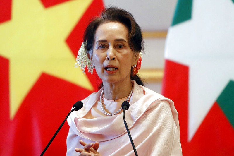 Burma's leader, Aung San Suu Kyi, speaks during a joint press conference with Vietnam's Prime Minister Nguyen Xuan Phuc after their meeting at the Presidential Palace in Naypyitaw, Burma, in this Dec. 17, 2019, file photo. Reports early Monday, Feb. 1, 2021, indicate that a military coup has taken place in Burma, and Suu Kyi has been detained under house arrest.