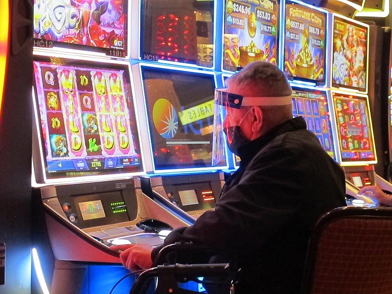 In this July photo, a man plays a slot machine at the Golden Nugget casino in Atlantic City N.J. 
(AP/Wayne Parry)