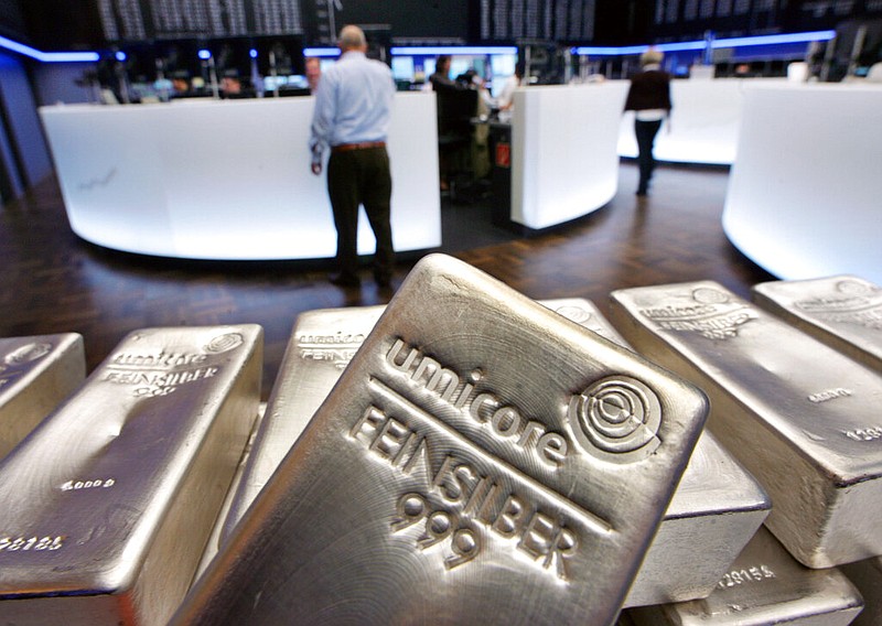 FILE - In this file photo dated Wednesday, May 9, 2007, Silver bullion, bars weighing five kilograms each, are displayed in the trading room of the stock exchange in Frankfurt, Germany. Silver futures jumped more than 10% on Monday Feb. 1, 2021, following strong gains over the weekend.(AP Photo/Michael Probst, FILE)