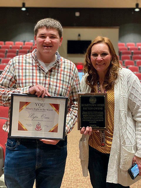 Payton Owens poses for a picture with his mom, Vicki Owens, after he received the “You Are What’s Right in the World” certificate on Jan. 22. The award was given to Payton after he saved his grandpa’s life Jan. 8 by using a homemade tourniquet