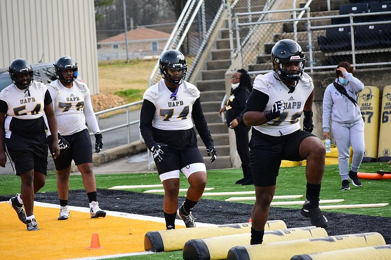 University of Arkansas at Pine Bluff offensive linemen perform high-knee drills during practice Jan. 29 at Simmons Bank Field. 
(Pine Bluff Commercial/I.C. Murrell)