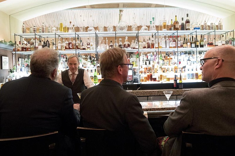 A bartender talks to a customer at the Gotham Bar and Grill in New York in this file photo. The Manhattan upscale restaurant hopes to reopen this year if government regulations permit, but will likely have just 35 staffers instead of the 100 the restaurant had before it closed in March 2020.
(AP)