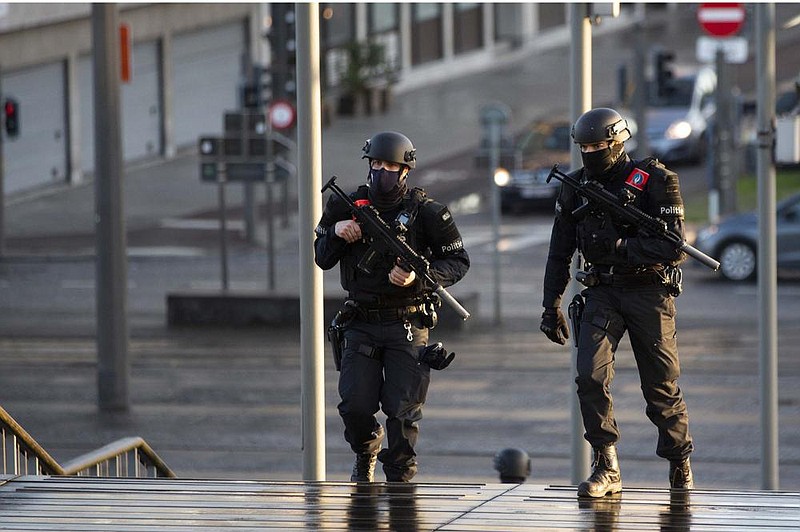 Police patrol outside a courthouse Thursday in Antwerp, Belgium, during the bomb-attack trial of four people, including an Iranian diplomat and Belgian-Iranian couple. More photos at arkansasonline.com/25diplomat/.
(AP/Virginia Mayo)