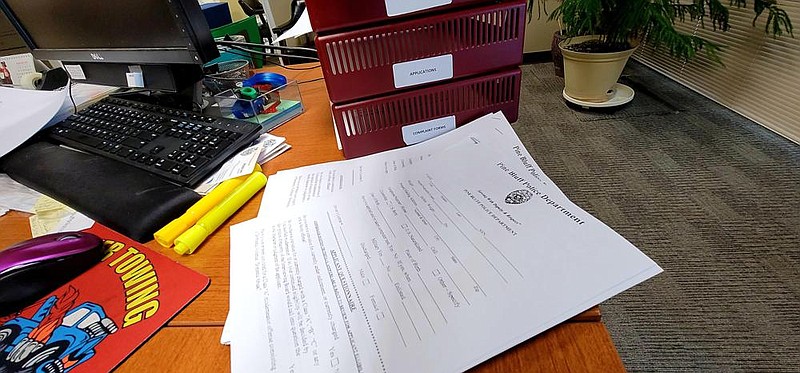 A stack of blank Police Department applications sits ready for applicants. 
(Pine Bluff Commercial/Eplunus Colvin)