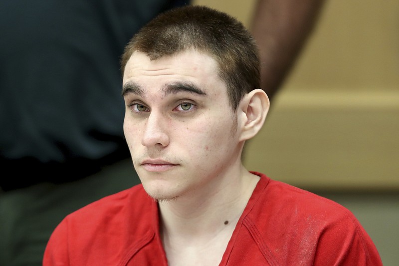 In this Dec. 10, 2019 Nikolas Cruz appears at a hearing in Fort Lauderdale Fla. The death penalty trial of Cruz, the man charged with killing 17 people at a Florida high school is off indefinitely because of restrictions related to the coronavirus. Broward Circuit Judge Elizabeth Scherer said Monday, June 22, 2020, in a hearing held remotely that it's not even clear when the courthouse will reopen to the public. It's been closed since March 16. Cruz is charged with fatally shooting 17 people and wounding 17 others at Marjory Stoneman Douglas High School on Valentine's Day 2018. (Amy Beth Bennett/South Florida Sun-Sentinel via AP, Pool) story.lead_photo.caption