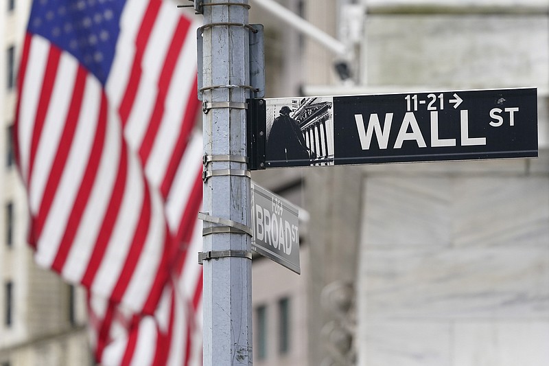 A street sign is displayed at the New York Stock Exchange in New York, Monday, Nov. 23, 2020. Stocks are opening higher on Wall Street, Wednesday, Feb. 10, 2021 as investors get back to buying a day after the S&P 500 ended a six-day winning streak.   (AP Photo/Seth Wenig)