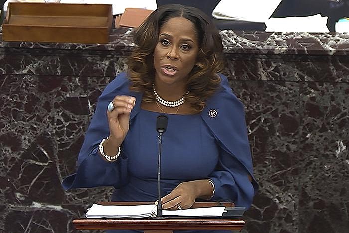House impeachment manager Stacey Plaskett, the Democratic delegate for the Virgin Islands, narrates U.S. Capitol security footage and other video recordings, tweets and posts during Wednesday’s impeachment trial. Plaskett said “the insurgents believed that they were doing the duty of their president. They were following his orders.”
(AP/Senate Television)