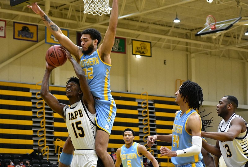 Alvin Stredic Jr. (15) of the University of Arkansas at Pine Bluff is fouled by Andre Allen (22) of Southern University during the second half Saturday, Feb. 13, 2021, at H.O. Clemmons Arena in Pine Bluff.