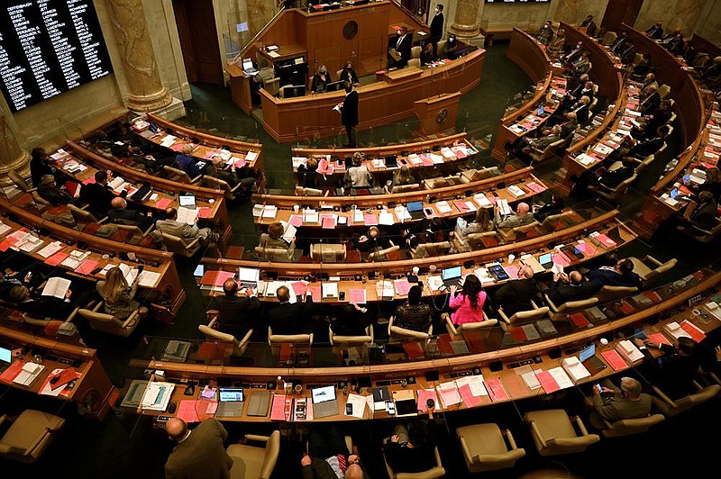 Members of the Arkansas House vote on a bill Monday. The Legislature is in recess until at least midweek because of expected inclement weather.
(Arkansas Democrat-Gazette/Stephen Swofford)