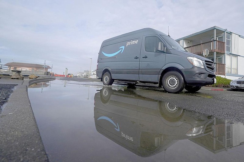 Amazon vans and trailers are parked outside of a delivery station in Newark, N.J., in October.
(AP/Michael Nagle)