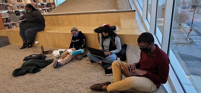 University of Arkansas at Pine Bluff students use the downtown Pine Bluff Library for group study on the second floor designated for teens and students. Students say they enjoy the quiet atmosphere, stable Wi-Fi and updated resources. 
(Pine Bluff Commercial/Eplunus Colvin)