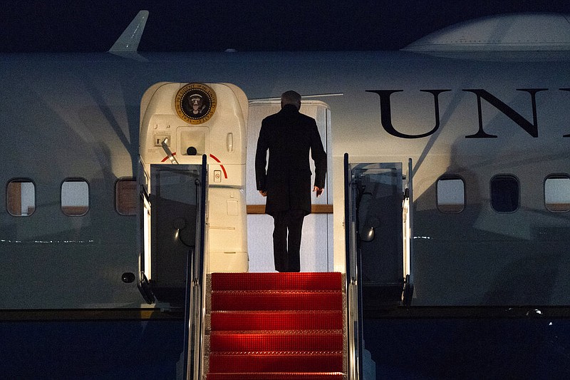 President Joe Biden boards Air Force One at Andrews Air Force Base, Md., on Friday, Feb. 12, 2021, en route to Camp David.