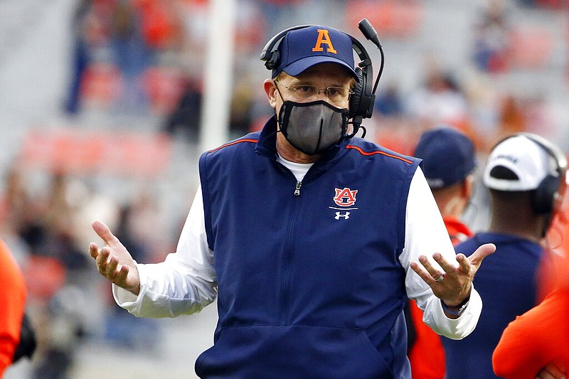 FILE - Auburn head coach Gus Malzahn reacts to a call during the second half of an NCAA college football game against LSU in Auburn, Ala., in this Saturday, Oct. 31, 2020, file photo. It’s been a whirlwind three weeks for Auburn, given longtime coach Gus Malzahn getting fired on Dec. 13, new coach Bryan Harsin being introduced 11 days later, several players opting out of the Citrus Bowl and the Tigers hurriedly trying to prepare for a showdown against a stout Northwestern defense. (AP Photo/Butch Dill, File)