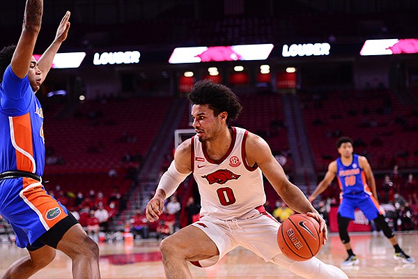 Arkansas' Justin Smith drives toward the basket during a game against Florida on Tuesday, Feb. 16, 2021, in Fayetteville. 