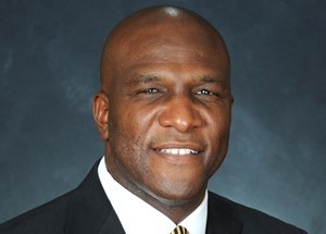 Athletics chief cites covid role in retiring