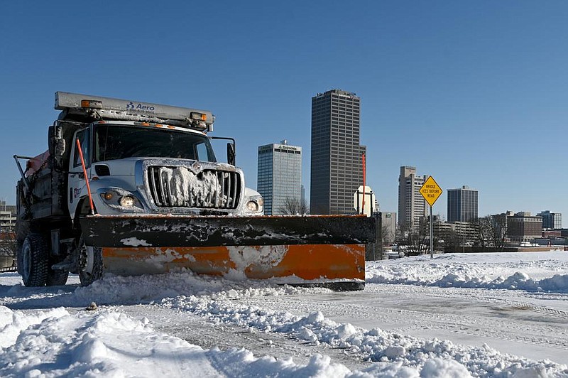A snowplow clears snow off of S. Chester Street in downtown Little Rock on Tuesday, Feb. 16, 2021.

(Arkansas Democrat-Gazette/Stephen Swofford)
