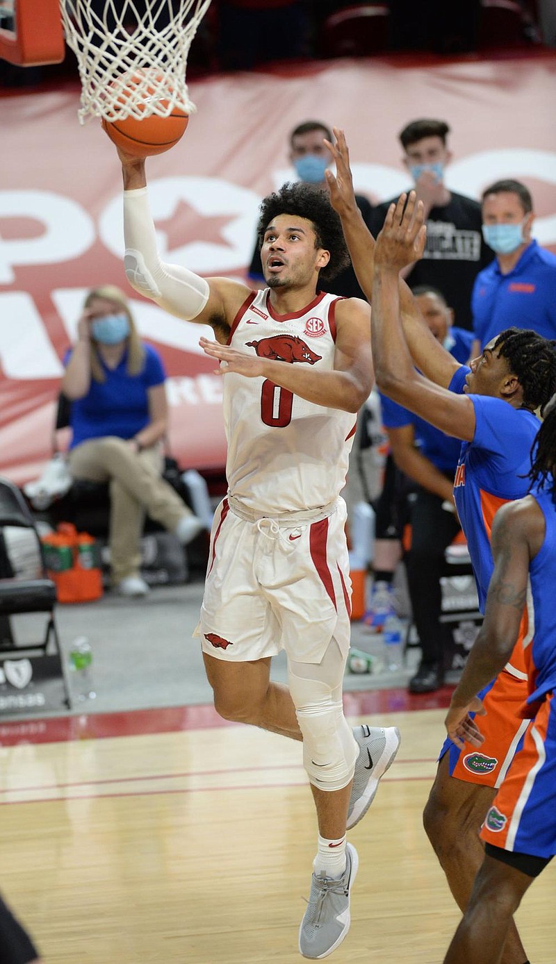 Arkansas forward Justin Smith goes up for a shot Tuesday during the No. 24 Razorbacks’ victory over the Florida Gators at Walton Arena in Fayetteville. Smith had 15 points on 7-of-9 shooting. (NWA Democrat-Gazette/Andy Shupe) 