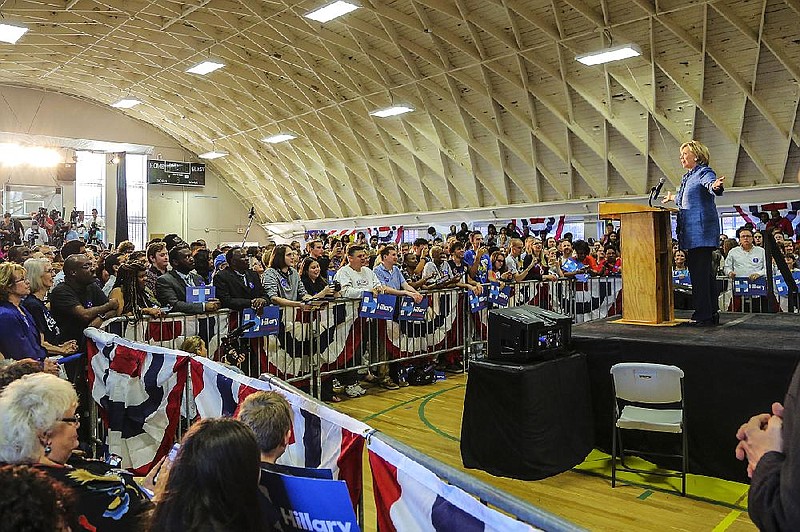 Former Secretary of State Hillary Clinton (right) speaks to supporters in the Sherman E. Tate Recreation Center on the campus of Philander Smith College in Little Rock in this Sept. 21, 2015, file photo.