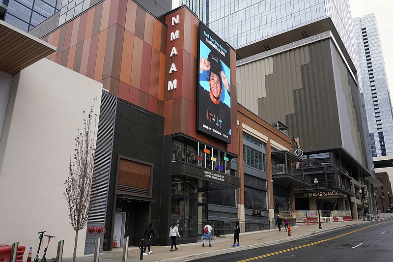 Visitors approach the entrance of the National Museum of African American Music on Jan. 30 in Nashville, Tenn. This new museum is the first to span multiple genres including gospel, blues, jazz, R&B and hip hop. (AP Photo/Mark Humphrey) story.lead_photo.caption
