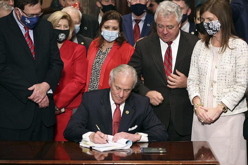 South Carolina Gov. Henry McMaster signs into law a bill banning almost all abortions in the state Thursday in Columbia. On the same day, Planned Parenthood filed a federal lawsuit to stop the measure from going into effect. The state House approved the “South Carolina Fetal Heartbeat and Protection from Abortion Act” on a 79-35 vote Wednesday and gave it a final procedural vote Thursday before sending it to McMaster.
(AP/Jeffrey Collins)