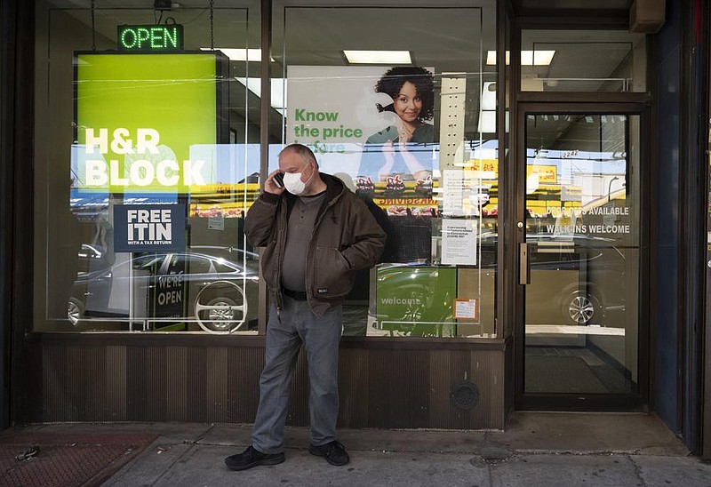 A man waits last April outside an H&R Block tax preparation office for an appointment in the Brooklyn borough of New York. A new program from H&R Block will offer free counseling to Black-owned businesses across the country.
(AP)