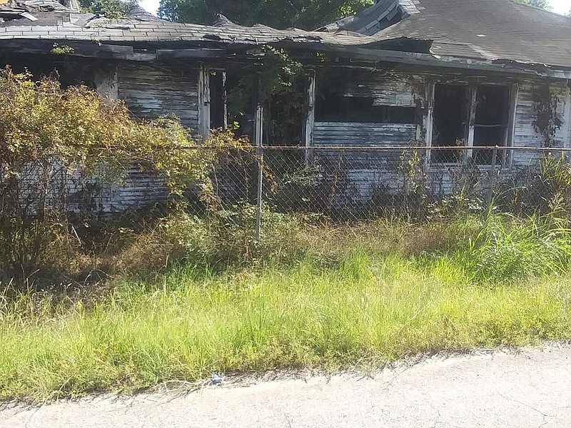 A blighted house sits at the corner of Second Avenue and Sycamore Street across from Mount Nebo Missionary Baptist Church. 
(Special to The Commercial)