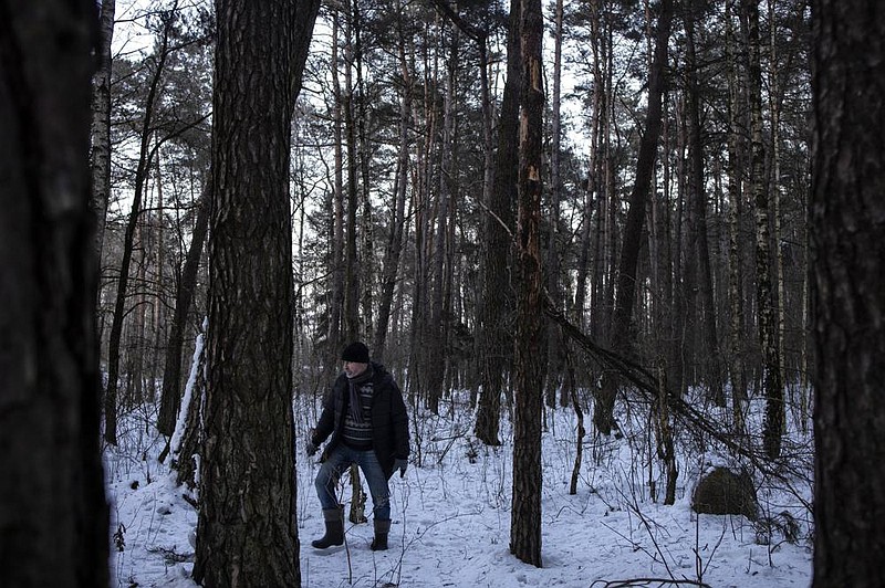 Zygmunt Malinowski stands near a forest memorial stone (right) where Jews were killed in the early 1940s outside Malinowo, Poland. “The war ended 75 years ago, but it still lives on in our bones. It will last forever,” he said.
(The New York Times/Maciek Nabrdalik)