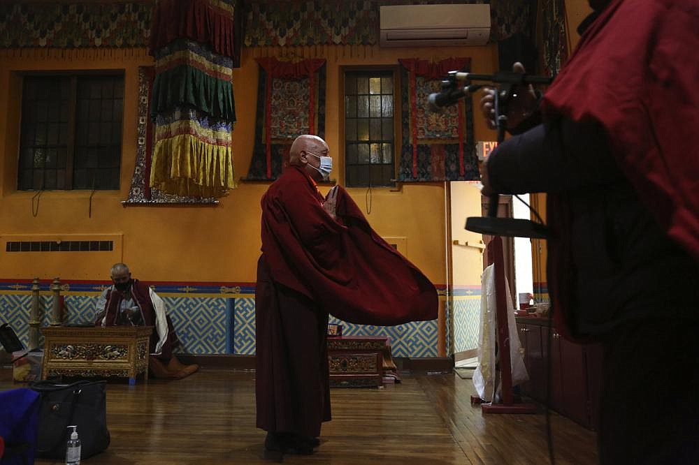 Lama Ngawang Yonten and other Buddhist members of the United Sherpa Association in the Queens borough of New York prepare for the Dakini Day practice, a group meditation that includes song and food and is celebrated on the 25th day of each lunar month, at their community temple.
(AP/Jessie Wardarski)