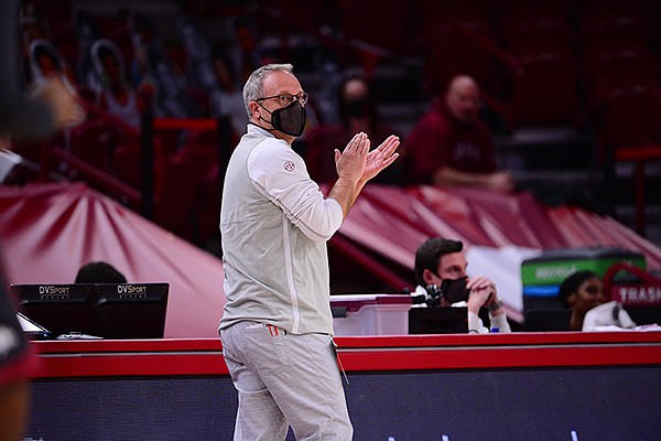 Arkansas coach Mike Neighbors is shown during a game against Ole Miss on Friday, Feb. 19, 2021, in Fayetteville. Arkansas coach Mike Neighbors is shown during a game against Ole Miss on Friday, Feb. 19, 2021, in Fayetteville.
