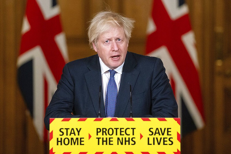 FILE - In this Friday, Jan. 15, 2021 file photo, Britain's Prime Minister Boris Johnson speaks during a media briefing on COVID-19, in Downing Street, London. Johnson is setting out a road map for lifting one of Europe’s strictest national lockdowns — but millions of Britons longing for a haircut or an evening out still face a long wait. Johnson is announcing plans Monday, Feb. 22, 2021 to ease restrictions in increments, starting by reopening schools in England on March 8. People will be allowed to meet one friend or relative for a chat or picnic outdoors from the same day. Three weeks later, people will be able to meet outdoors in groups of up to six outdoors. But restaurants, pubs, gyms and hairdressers are likely to remain closed until at least April. (Dominic Lipinski/Pool via AP, File) story.lead_photo.caption