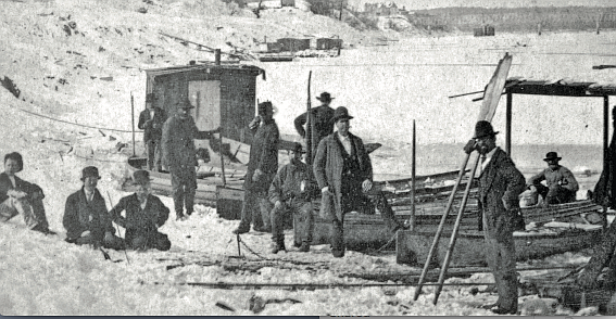 Several men stand beside small boats at the edge of the frozen Arkansas River in Pulaski County during the winter of 1876. (Special to the Democrat-Gazette)