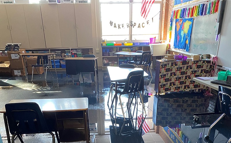 This photo provided by the Little Rock School District shows a flooded room.