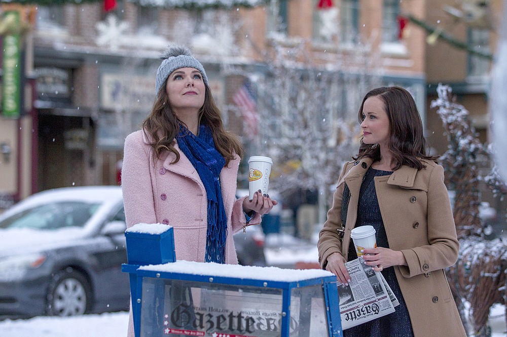 Lauren Graham (left) and Alexis Bledel star in “Gilmore Girls,” one of the many shows and movies people are rewatching during the quarantine. (Netflix/Saeed Adyani)