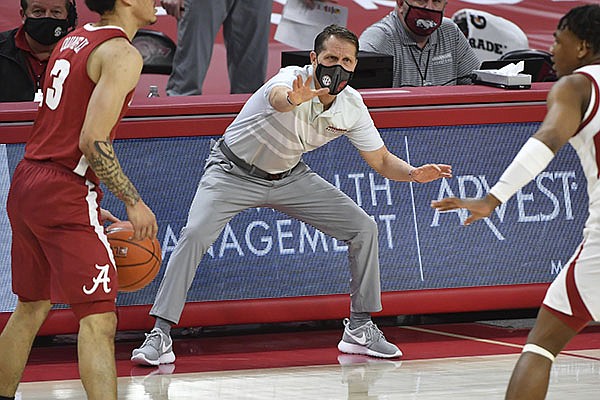 Arkansas coach Eric Musselman reacts to a play against Alabama during the first half of an NCAA college basketball game in Fayetteville, Ark. Wednesday, Feb. 24, 2021. (AP Photo/Michael Woods)
