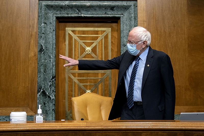 Sen. Bernie Sanders, I-Vt., Chairman of the Budget Committee, gestures before a U.S. Senate Budget Committee hearing regarding wages at large corporations on Capitol Hill in Washington, Thursday, Feb. 25, 2021. (Stefani Reynolds/The New York Times via AP, Pool)